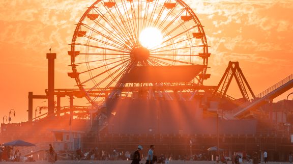 A Ferris Wheel At Sunset